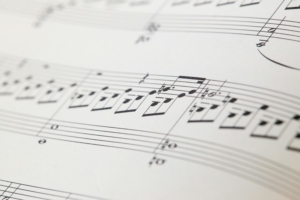 musical notes on paper; Photo by César Guillotel