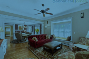 Welcoming living room with a couch and coffee table in a SabbaticalHomes.com rental home.