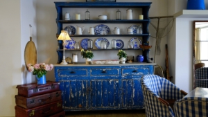 House with blue china hutch