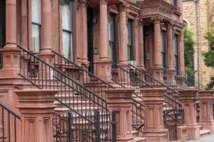 Exterior of city buildings with front porches.